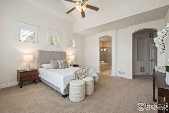 3122 Notabon Ct, Lafayette, CO 80026 - bedroom featuring arched walkways, light colored carpet, vaulted ceiling, ensuite bathroom, and ceiling fan