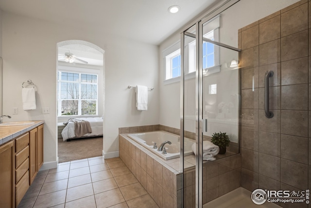 3122 Notabon Ct, Lafayette, CO 80026 - full bath with a bath, vanity, a stall shower, tile patterned floors, and a ceiling fan