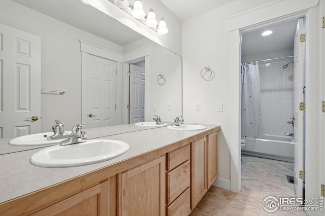 3122 Notabon Ct, Lafayette, CO 80026 - bathroom featuring double vanity, shower / bath combo with shower curtain, and tile patterned flooring