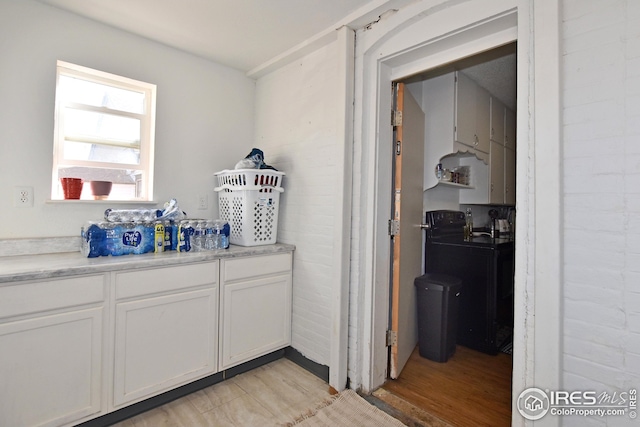 1021 5th St, Greeley, CO 80631 - bar featuring washer / dryer and light wood-type flooring