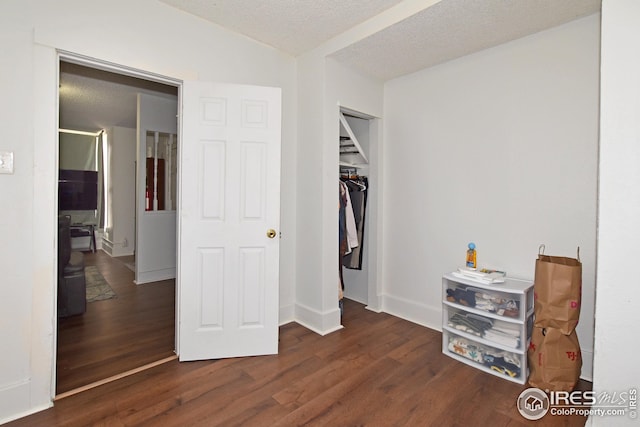 1021 5th St, Greeley, CO 80631 - bedroom featuring baseboards, wood finished floors, a textured ceiling, and a closet