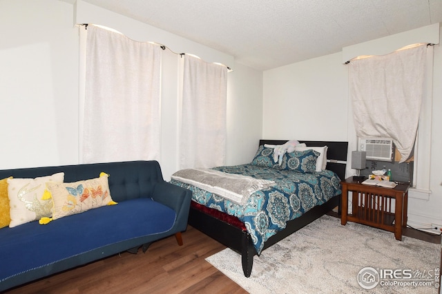 1021 5th St, Greeley, CO 80631 - bedroom featuring wood finished floors and cooling unit