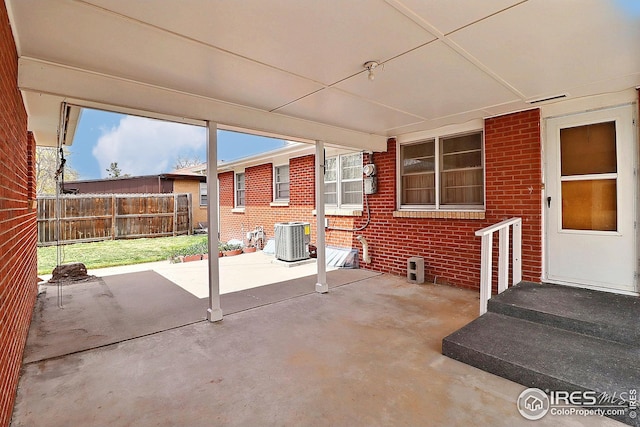 view of patio / terrace with fence and cooling unit