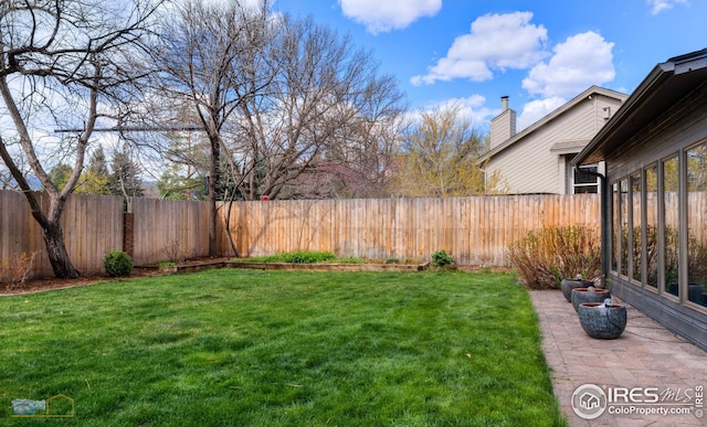 view of yard featuring a fenced backyard