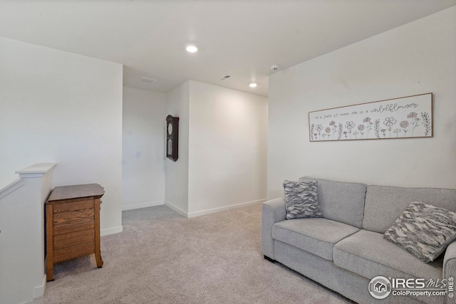 living area featuring baseboards, recessed lighting, visible vents, and carpet