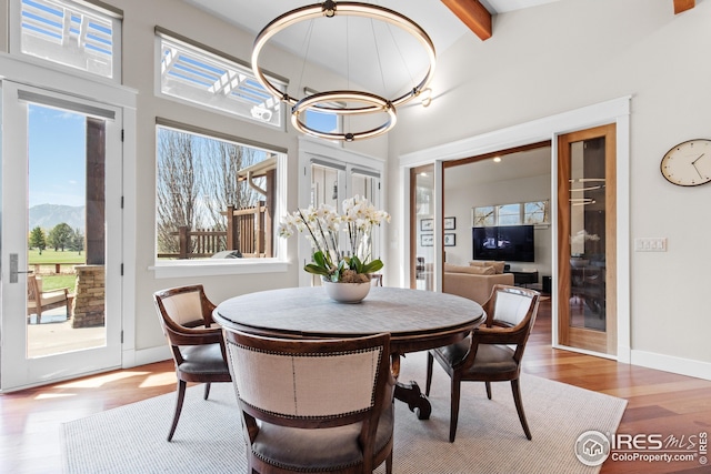 1533 Old Tale Rd, Boulder, CO 80303 - dining room with wood finished floors, a chandelier, and a mountain view