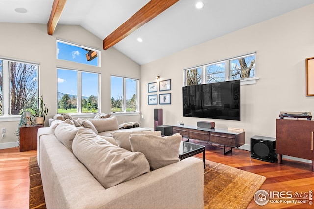 1533 Old Tale Rd, Boulder, CO 80303 - living area with beamed ceiling, wood finished floors, recessed lighting, and high vaulted ceiling