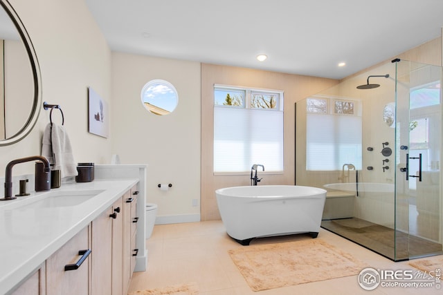 1533 Old Tale Rd, Boulder, CO 80303 - full bathroom featuring vanity, a shower stall, a freestanding tub, tile patterned floors, and recessed lighting