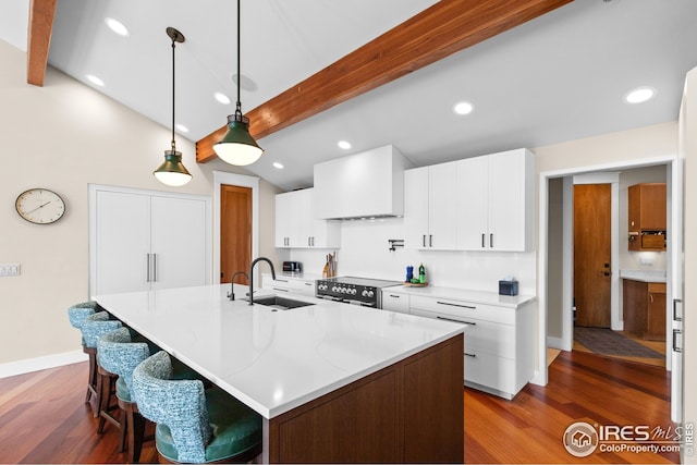 1533 Old Tale Rd, Boulder, CO 80303 - kitchen with premium range hood, recessed lighting, wood finished floors, range with electric cooktop, and white cabinets