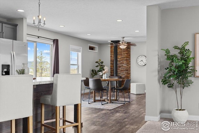dining space with a textured ceiling, baseboards, recessed lighting, dark wood-type flooring, and a ceiling fan