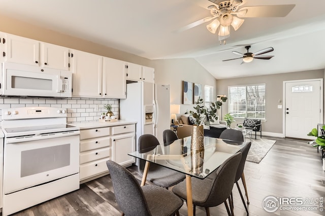 kitchen with dark wood-style flooring, ceiling fan, backsplash, white appliances, and lofted ceiling