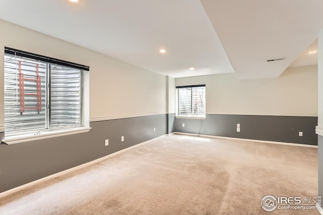 spare room featuring baseboards, visible vents, carpet flooring, and recessed lighting