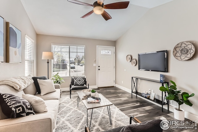 living area with baseboards, wood finished floors, a ceiling fan, and lofted ceiling