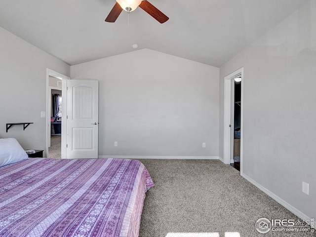 bedroom with baseboards, ceiling fan, carpet floors, and lofted ceiling