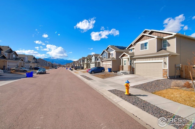 view of road with curbs, sidewalks, and a residential view