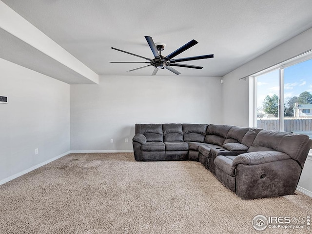 living room featuring ceiling fan, baseboards, and carpet floors