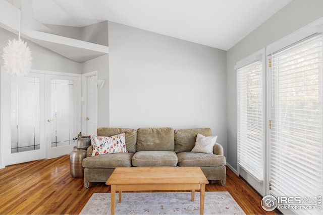 1891 Orchard Ave, Boulder, CO 80304 - living room featuring vaulted ceiling and wood finished floors