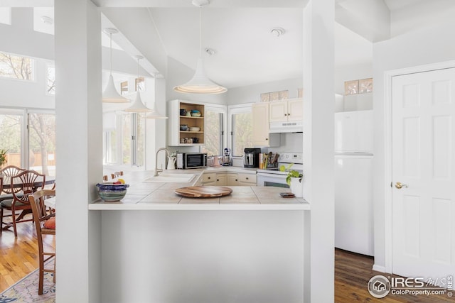1891 Orchard Ave, Boulder, CO 80304 - kitchen with white appliances, a sink, under cabinet range hood, tile countertops, and plenty of natural light