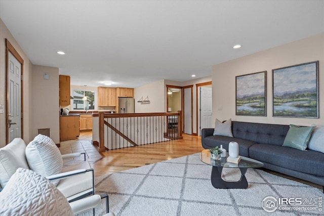 living room featuring recessed lighting and light wood finished floors