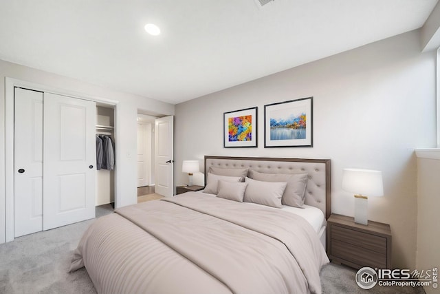bedroom featuring a closet and carpet floors