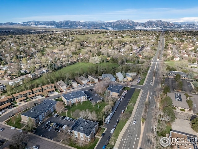 birds eye view of property with a mountain view