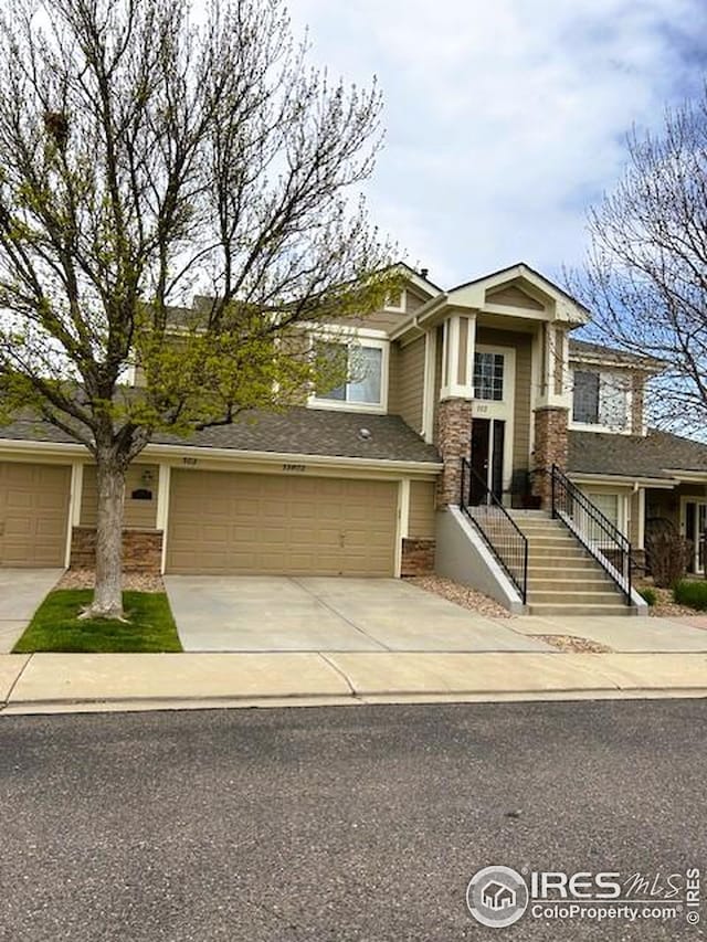 craftsman house featuring concrete driveway and an attached garage