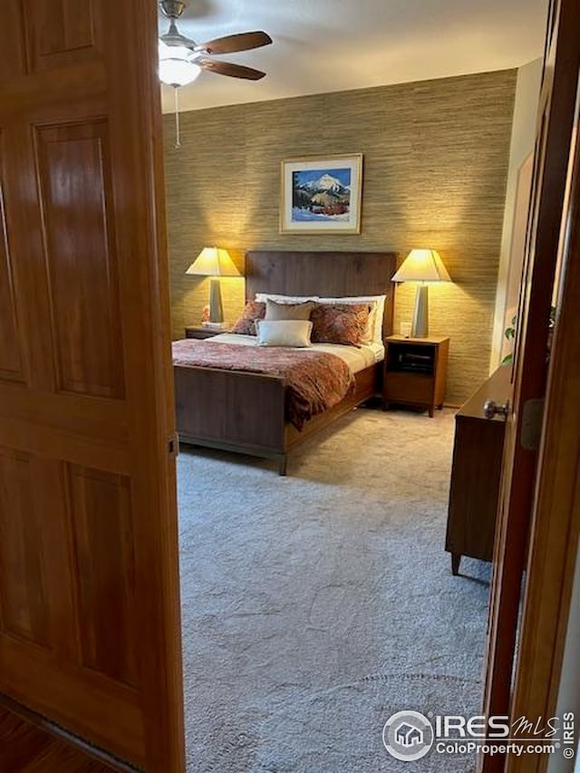 bedroom with ceiling fan and carpet flooring