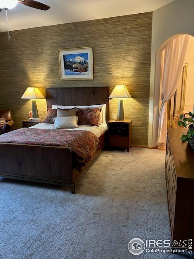 carpeted bedroom with a ceiling fan