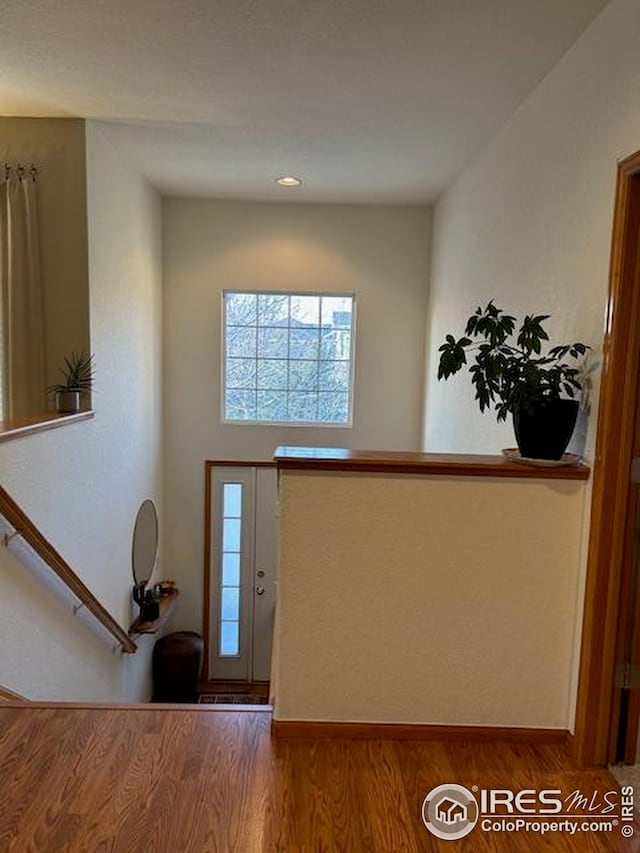 entrance foyer featuring baseboards, recessed lighting, and wood finished floors