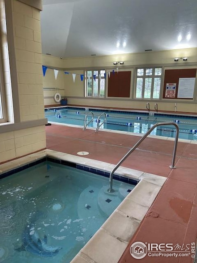 pool featuring an indoor hot tub