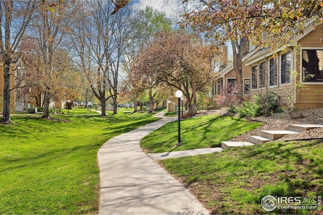 view of home's community featuring a yard