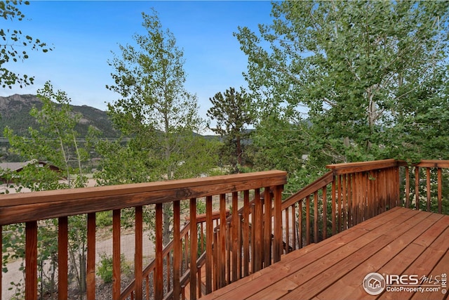 wooden deck featuring a mountain view