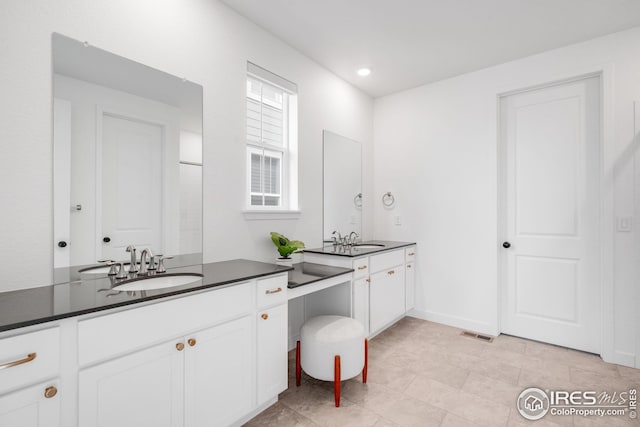 full bath with visible vents and vanity