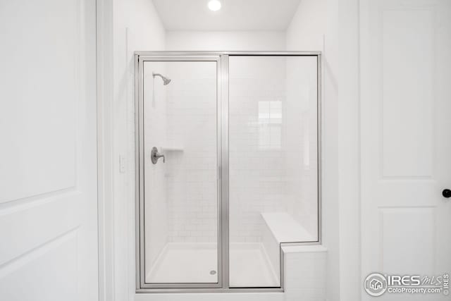 bathroom featuring a stall shower