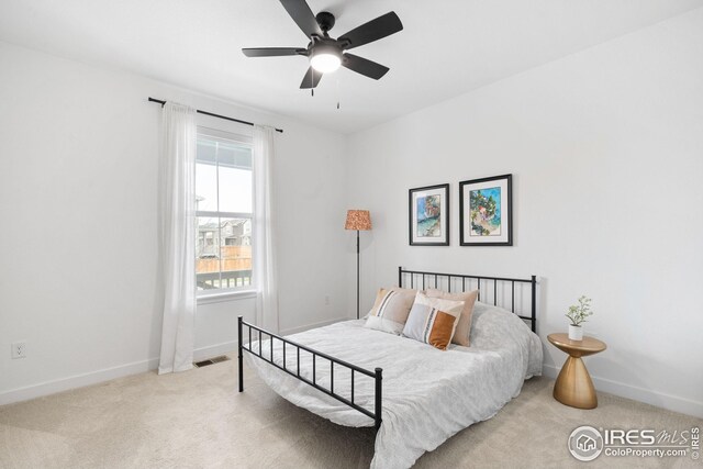 bedroom featuring visible vents, carpet floors, and baseboards