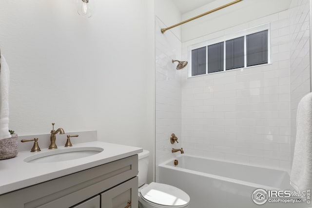 full bath featuring washtub / shower combination, vanity, and toilet