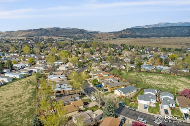 drone / aerial view with a residential view and a mountain view