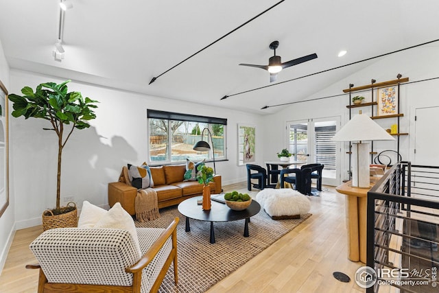 living room with recessed lighting, baseboards, light wood-type flooring, a ceiling fan, and lofted ceiling