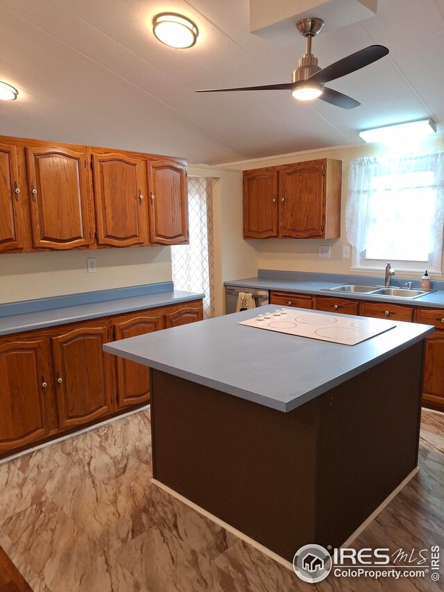 kitchen with white electric stovetop, ceiling fan, and brown cabinetry