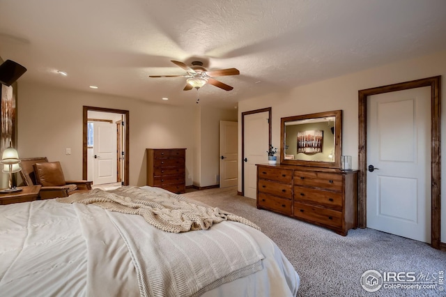 bedroom with recessed lighting, a ceiling fan, light carpet, and baseboards