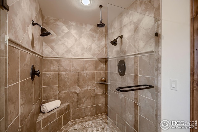 full bathroom with a tile shower