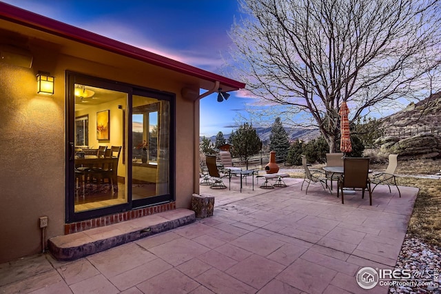 view of patio / terrace with a mountain view and outdoor dining area