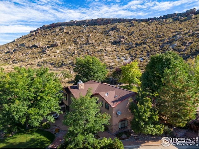 birds eye view of property featuring a mountain view