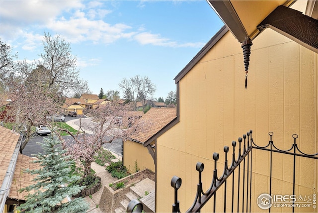 exterior space featuring a residential view and a balcony