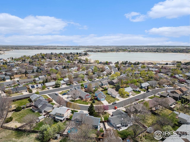 aerial view featuring a water view and a residential view