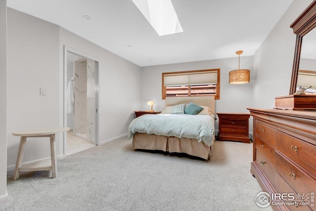bedroom featuring a skylight, light carpet, and baseboards