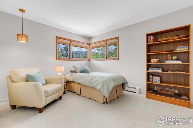 bedroom with light colored carpet and a baseboard heating unit