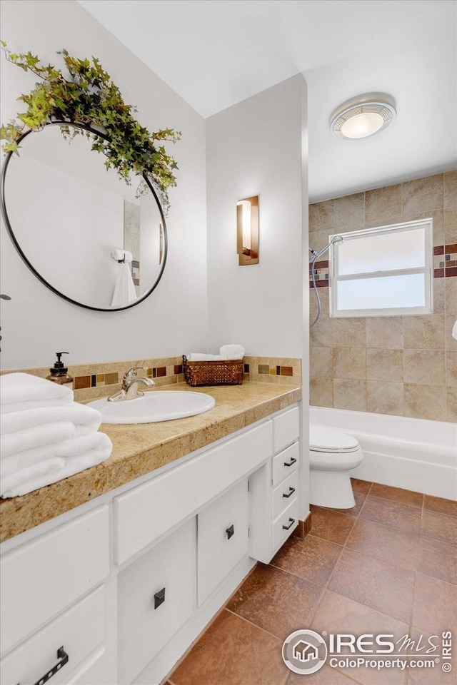full bathroom featuring shower / bathtub combination, toilet, and vanity