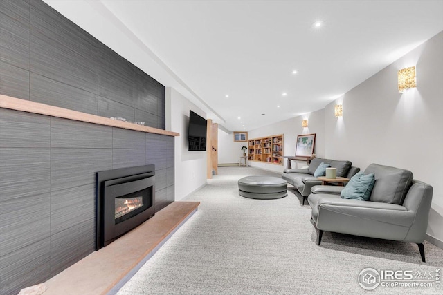 living area with a fireplace, carpet, recessed lighting, baseboards, and lofted ceiling