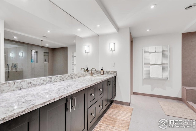 full bathroom featuring an enclosed shower, recessed lighting, baseboards, and vanity